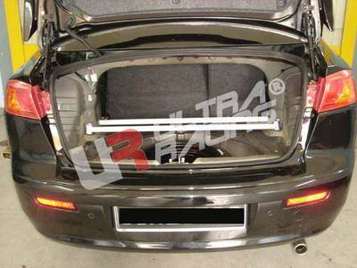 [Obr.: 10/55/74/9-mitsubishi-lancer-07-ultra-r-4-point-rear-trunk-brace-1696469259.jpg]